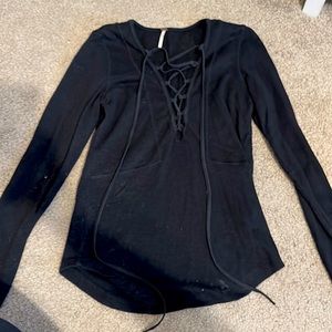 Black Free People lace up top. Size medium. Cotton, good condition